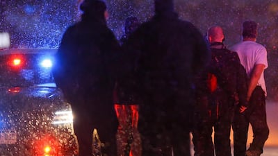 A suspect is led away in handcuffs by police during an active shooter situation outside a Planned Parenthood facility where an active shooter reportedly injured up to eleven people, including at least five police officers, on November 27 in Colorado Springs, Colorado. Justin Edmonds/AFP