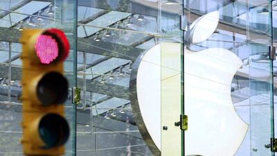 The Apple logo shines inside of an Apple Store in New York. The company is said to be turning its attention to the motoring industry. Lucas Jackson / Reuters