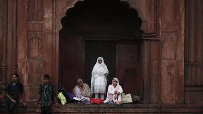 A Muslim woman offers evening prayers on the last day of the holy fasting month of Ramadan in India, at the Jama Masjid (Grand Mosque) in the old quarters of Delhi. Adnan Abidi / Reuters