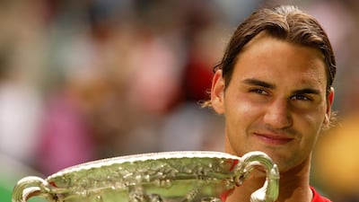 Roger Federer with the Australian Open trophy after his first victory in 2004. Getty