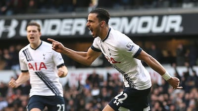 Tottenham Hotspur’s Belgian midfielder Nacer Chadli (R) celebrates after scoring their first goal during the English Premier League football match between Tottenham Hotspur and Swansea City at White Hart Lane in London, on February 28, 2016. Tottenham won the game 2-1. AFP / JUSTIN TALLIS