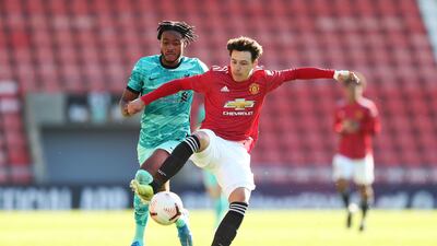 Manchester United's Marc Jurado battles for possession with James Balagizi of Liverpool. Getty Images
