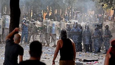 Lebanese security forces confront protesters during clashes in downtown Beirut. AFP