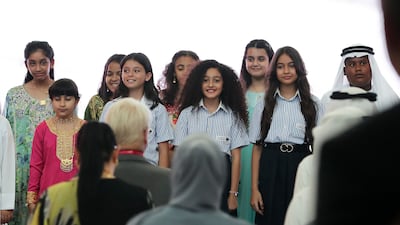 Children sing the UAE's national anthem on the opening day of the Future Innovation Summit.