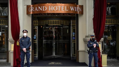 Austrian police officers stand in front of a hotel during bilateral meetings for a JCPOA Joint Commission Iran talks meeting in Vienna, Austria, 20 April 2021. EPA