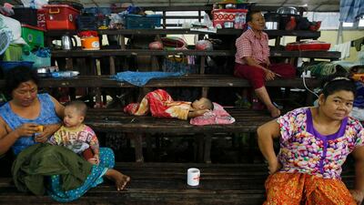 epa06923061 Residents take shelter at a temporary evacuation center in Hpa-An Township, Kayin State, Myanmar, 02 August 2018. At least 12 people have died and over 148,000 have been displaced by severe floods in several areas across Myanmar, according the Government's Department of Disaster Management. Heavy monsoon rains in the country have seen many regional rivers and water ways hit their highest water level in more than 50 years. EPA/LYNN BO BO