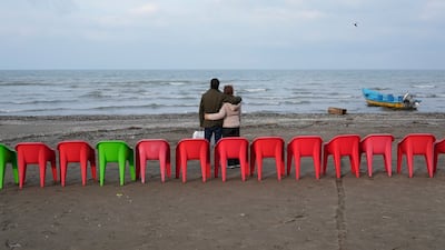 A couple on the shores of the Caspian Sea outside the port city of Bandar Anzali, Iran. AP