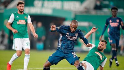 Arsenal's Alexandre Lacazette is tackled by Filip Stojkovic of Rapid Vienna. Getty