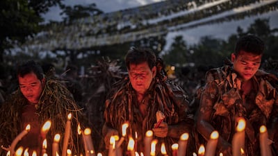Devotees covered in mud and dried banana leaves take part in the Taong Putik ("mud people") Festival in the village of Bibiclat in Aliaga town, Nueva Ecija province, Philippines. Each year, the residents of Bibiclat village in Aliaga town celebrate the Feast of Saint John by covering themselves in mud, dried banana leaves, vines, and twigs as part of a little-known Catholic festival. Getty Images