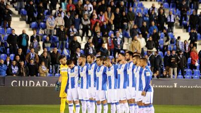 Leganes players hold a minute of silence for the victims of the plane carrying Chapecoense prior to the Copa del Rey match against Valencia. Denis Doyle / Getty Images