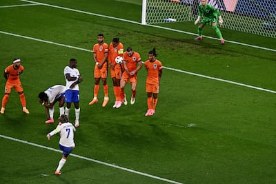 Antoine Griezmann hits the free kick. AFP