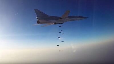 A Russian Tupolev-22M3 drops bombs on Jabhat Fatah Al Sham (formerly Jabhat Al Nusra) targets in Aleppo province on August 16, 2016, after taking off from the Hamedan air base in Iran. Russian Defence Ministry/Handout/EPA