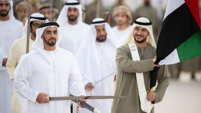 Lt Gen Sheikh Saif bin Zayed, Deputy Prime Minister and Minister of Interior, participates in a traditional ayyala during the Union Parade. Abdullah Al Junaibi for the Presidential Court