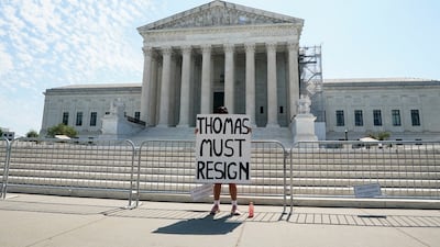 A woman calling for the resignation of Justice Clarence Thomas outside the US Supreme Court, in Washington, on, June 14. Reuters