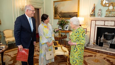 Queen Elizabeth II meets Australian Prime Minister Scott Morrison and his wife Jennifer during a private audience at Buckingham Palace, in London. Reuters