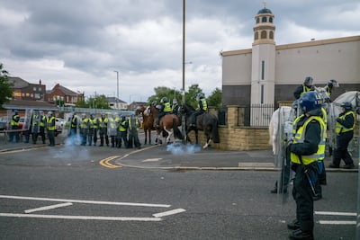 Riot police defend a mosque in Sunderland during a far-right protest in August 2024. Getty Images