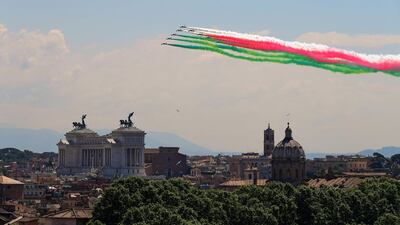The Italian Air Force aerobatic unit Frecce Tricolori (Tricolor Arrows) spreads smoke with the colours of the Italian flag over the city of Rome. AFP