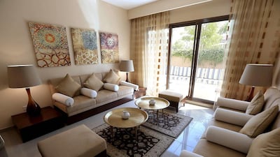 The lounge area of the 5 bedroom villa. When compared to Dubai house prices they are pretty affordably priced with a 4,170 square foot five bedroom villa selling for something in the region of between Dh3 million and Dh3.5 million. Pawan Singh / The National
