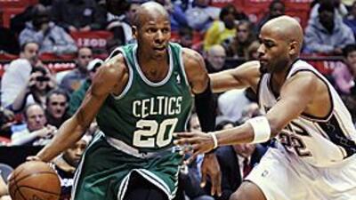 The Boston Celtics guard Ray Allen (20) drives around New Jersey Nets' forward Jarvis Hayes to score in the third quarter.