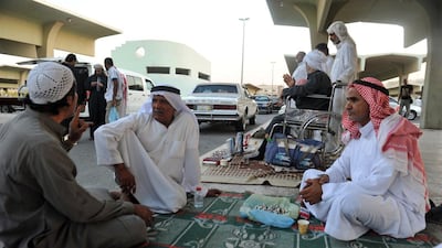 Street vendors chat at a market in the mainly Shiite Saudi coastal town of Qatif, 400km east of Riyadh. AFP / November 11, 2014