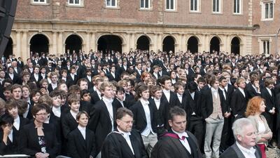 Eton pupils look on as Queen Elizabeth II and Prince Philip, Duke of Edinburgh attend the 150th Anniversary of the Eton Combined Cadet Force at Eton College. Getty