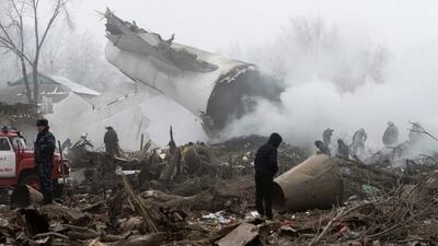Rescue teams are seen at the crash site of a Turkish cargo jet near Kyrgyzstan's Manas airport outside Bishkek, on January 16, 2017. Vladimir Pirogov / Reuters