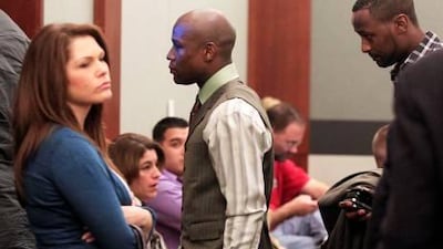 Boxer Floyd Mayweather Jr, centre, leaves court after pleading guilty at the Clark County Regional Justice Center in Las Vegas this week.