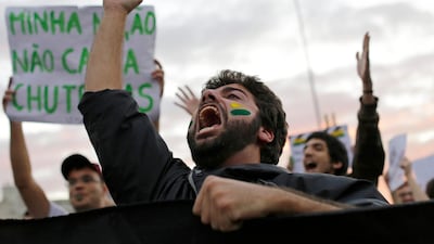 A demonstrator shouts during a protests in Sao Paulo, Brazil. AP Photo / Nelson Antoine