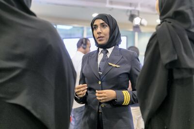 Salma al Baloushi, Etihad Airways' first female pilot, talks to new recruits. Reem Mohammed / The National