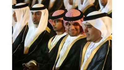 Grooms wearing the gold-trimmed black bishts presented by Sheikh Mohammed bin Hamad, the Crown Prince of Fujairah, at the mass ceremony at Al Bustan hall.