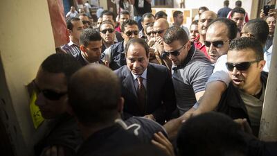 Mr El Sisi, centre, who quit the army in March to run for president, is riding a wave of popularity after ousting Islamist president Mohamed Morsi in July last year, and crushing his Muslim Brotherhood movement. Khaled Desouki/AFP Photo