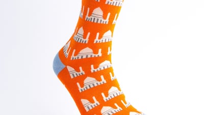 The Jummah Mubarak sock: “Every Friday, men go to the mosque for prayer. During this time, they stand next to one another in unity. And the orange background is simply to brighten their day!”