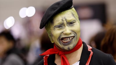 A cosplayer doesn't smile for the camera. EPA