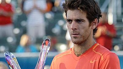 Juan Martin del Potro holds his trophy after defeating Janko Tipsarevic 6-4, 6-4 to win the Delray Beach International Tennis Championships.