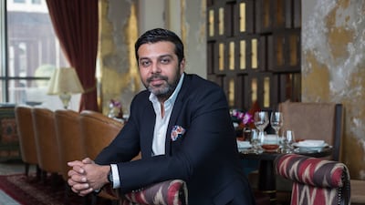 Girish Mahtani, the founder of Nine Stars International, pictured at Coya with some of his company’s furniture. Victor Besa for The National