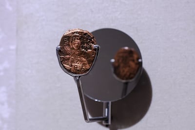 A medieval Byzantine copper coin found on site at Al Maqta'a Tower. Victor Besa / The National