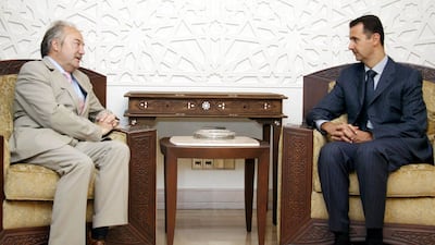 Pro-Palestinian former MP George Galloway with Syria's deposed president Bashar Al Assad in 2005. AP
