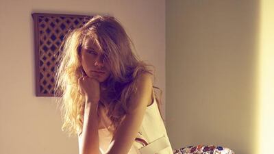 ON THE LEVEL: Sequinned jacket (on chair), Dh5,120, Alice & Olivia. Dress, Dh11,000, Victoria Beckham. Formula 1-McLaren limited-edition watch, price on request, Tag Heuer. Shoes, Dh1,800, Stuart Weizman