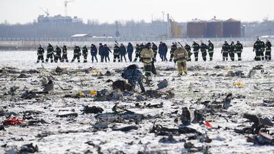 Russian Emergency Ministry employees investigate the wreckage of a crashed plane at the Rostov-on-Don airport, about 950 kilometres south of Moscow, Russia. Winds were gusting before dawn Saturday over the airport in the southern Russian city of Rostov-on-Don when a plane carrying 62 people from Dubai. AP Photo
