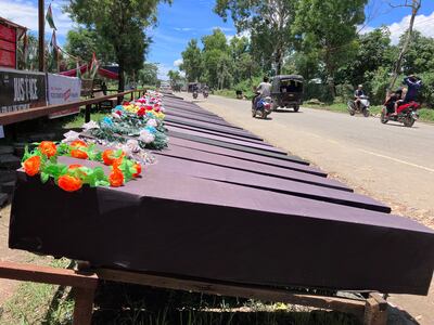 Empty coffins kept outside a road in Chuarchandpur district as a mark of remembrance of those Kukis killed in the ethnic clashes. Taniya Dutta/ The National