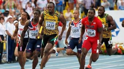 Jamaica's Usain Bolt anchors his team to gold in the men's 4x100m relay.