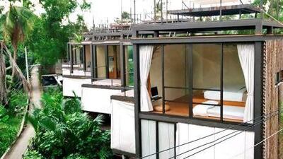 Cabins on stilts sit above the Schao Phraya River. Courtesy Bangkok Tree House.