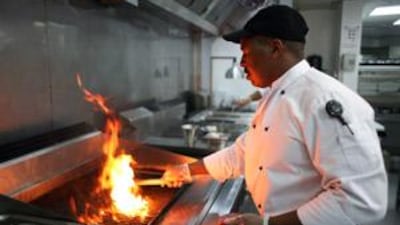 Great Mabuzza prepares steak at the Downtown Grill.