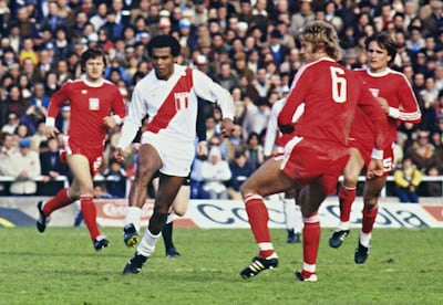 Peruvian forward Teofilo Cubillas runs between Polish defenders during the World Cup in 1978. AFP Photo