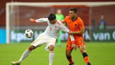 Spain striker Alvaro Morata battles for possession with Joel Veltman of Netherlands. Getty Images