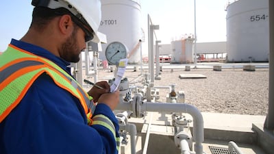An employee is pictured working at the Bin Omar natural gas station, north of the southern Iraqi port of Basra. AFP