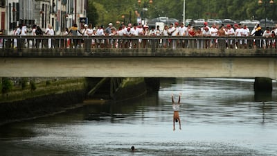 People dive into the Nive river during the Bayonne festival in south-western France. AFP