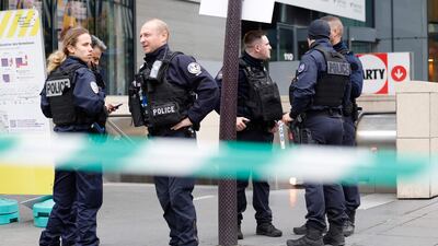 French police officers guard the entrance of a metro station after a woman making threats on a train was shot and wounded in Paris. AFP