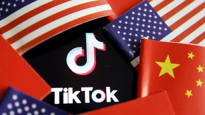 China and US flags are seen near a TikTok logo in this illustration picture taken July 16, 2020. REUTERS