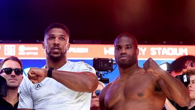 Anthony Joshua, left, and Daniel Dubois during weigh-in ahead of their Riyadh Season - Wembley Edition bout at Trafalgar Square. Getty Images